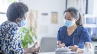 Doctor reviewing medical information with patient
